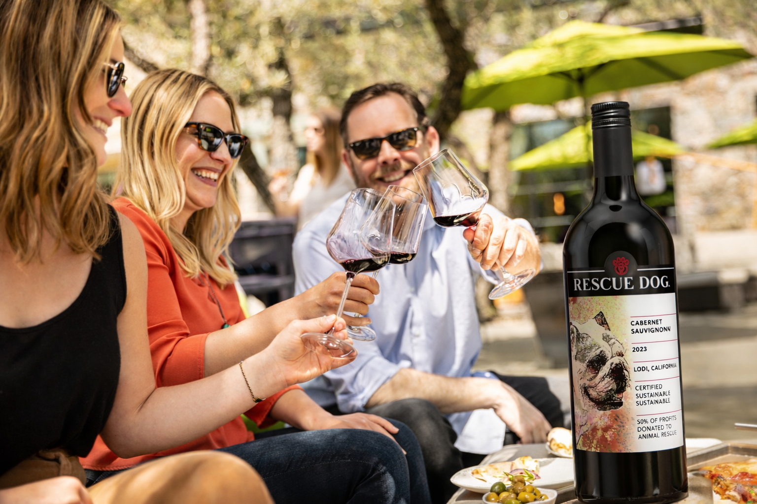 Friends toasting with Rescue Dog Wines Cabernet Sauvignon